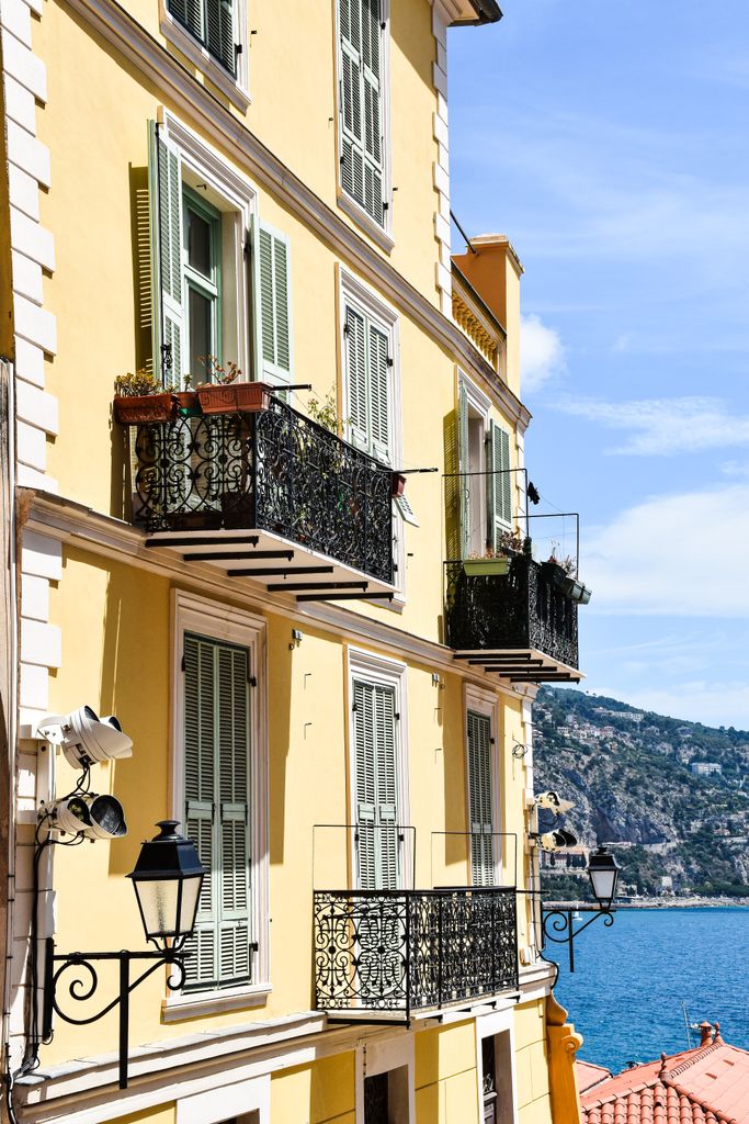 Elegant balconies and sea view on a sunny day in the French Riviera.